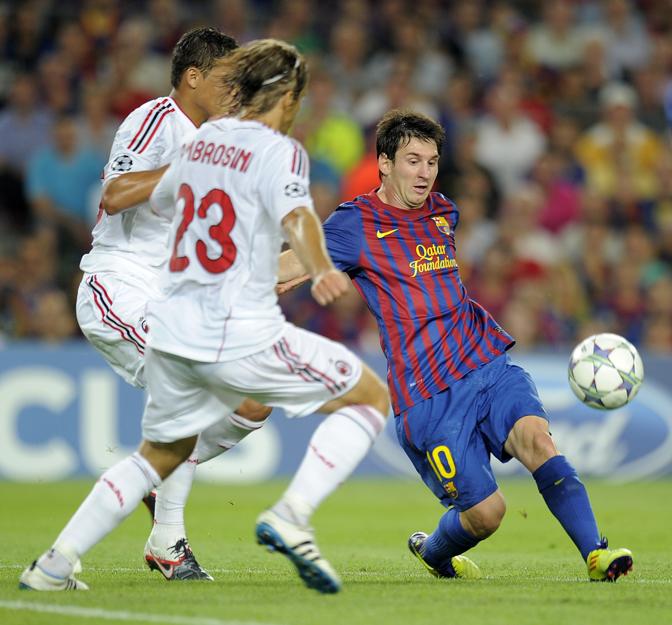 Ambro contro Messi nella Champions 2011-12. Afp